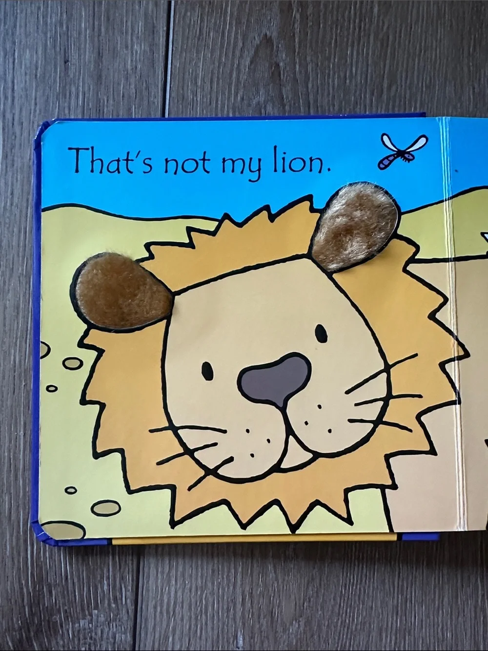 Usborne That's Not My Lion Touchy-Feely Board Book - Purple & Yellow